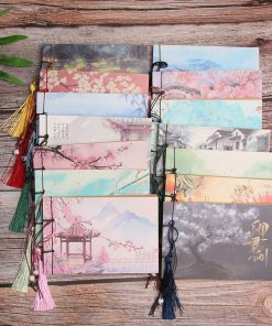 A blank notebook with tassels